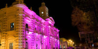 Hermosillo, Mexico - October 20, 2011: Downtown Hermosillo at night, view of the government palace bathed in pink light, located in Plaza Zaragoza in front of the city's cathedral.